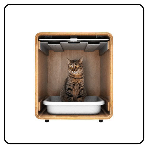 A sleek, modern Fable Pets Cove cat litter box in a matte finish, featuring a minimalist open-top design with an integrated cleaning scoop and brush set docked on the side.