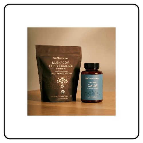 Real Mushrooms Calm Ritual Duo featuring a bottle of Lion’s Mane CALM capsules and a bag of Mushroom Hot Chocolate Mix on a neutral background.